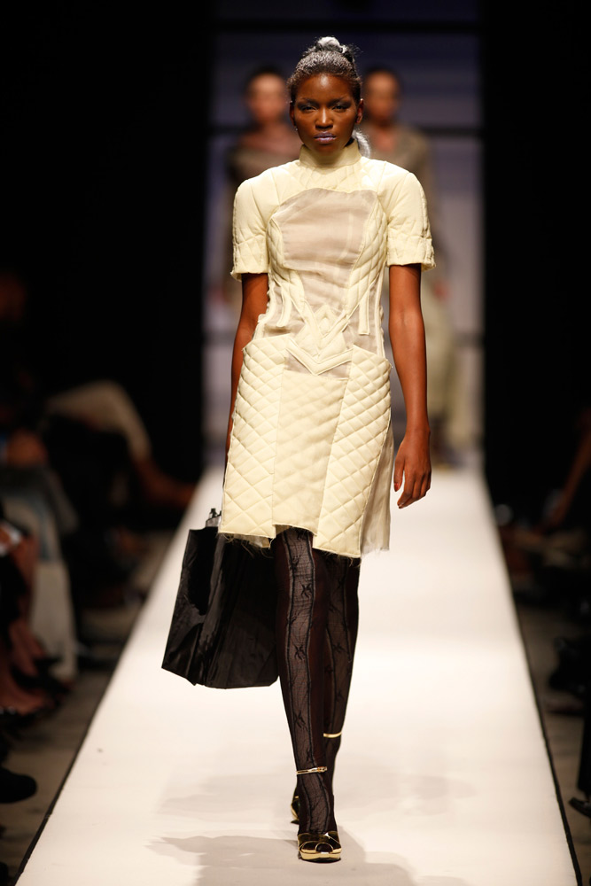 Model wearing structured white quilted design on SA Fashion Week runway
