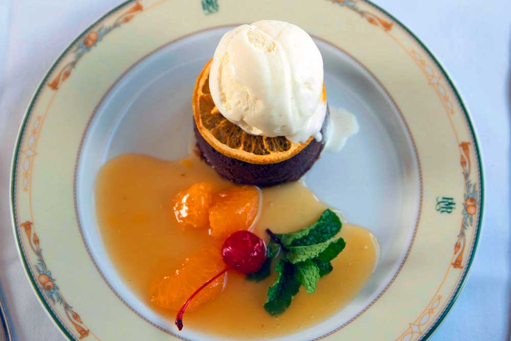 Chocolate brownie tower with vanilla ice cream and caramelised orange, fine dining dessert photography